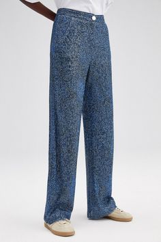 Make a statement in these Denim Look Sequin Trousers. With a denim-like look and shimmering sequins, these trousers will have you shining from head to toe! Experiment with different styles to discover your own unique look. Get ready to channel your inner fashionista and look glamorous all night long! * Height: 106 cm * Waist: 34 cm * Hip: 45 cm * Model Height: 177 cm * Model Size: 36 * Fabric: * %100 Polyester Chic Glitter Bottoms For Spring, Trendy Blue Party Pants, Chic Shimmer Pants For Spring, Blue Sequined Wide Leg Bottoms, Trendy Fitted Glitter Bottoms, Blue Sequin Pants For Night Out, Glamorous Blue Sequined Pants, Shimmer Wide Leg Bottoms For Spring, Metallic Sequined Bottoms For Spring