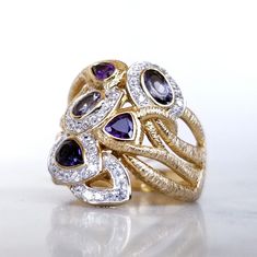 Sterling Silver 18k Gold Plated Ring With Topaz, Amethyst, And Tanzanite Size 9.5 Brand New, Never Worn With Tags 18k Gold Plated Over Sterling Silver Small White Topaz, Amethyst, Smoke Topaz, Blue Topaz, And Tanzanite Finished Under Gallery Ring Size 9.5 Elegant Multi-stone Amethyst Ring In Yellow Gold, Yellow Gold Multi-stone Fusion Gemstones, Fusion Style Multi-stone Yellow Gold Gemstones, Yellow Gold Gemstones For Anniversary, Formal Tanzanite Multi-stone Gemstones, Luxury Purple Multi-stone Sapphire Ring, Gold Luxury Amethyst Multi-stone Ring, Luxury Gold Amethyst Multi-stone Ring, Fusion Style Multi-stone Yellow Gold Rings