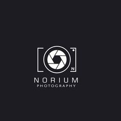 a black and white logo with the word nourim photography on it's side