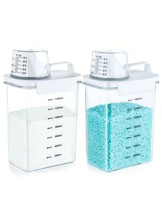 two plastic containers filled with blue and white stuff next to each other on a white surface