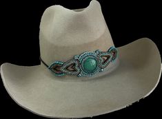 Large Turquoise Dyed stone center and Turquoise and Gold Seed beads on sides. Stretchy cording in back. Wear to Rodeos, Parades, Barrel Racing, Anywhere anytime! upscale your had with this stunning hat Band! READY TO SHIP! OVERVIEW : STUNNING STONE CENT4ER PIECE SEED BEADS SURROUND EACH SIDE OATTERN UPSCALE YOUR HAD STRETCBHES TO FIT MALE OR FEMALE HATS MATERIALS: TURQUOISE DYED STONE CENTER TURQUOISE SEED BEADS' GOLD SEED BEDS CLOTH BACKING STRETCHY CORDING IN BACK This hatband is a stunnning addition to your had! make everyone take a second look at your hat! Turquoise Hat, Turquoise And Gold, Barrel Racing, Western Belts, Hat Band, Hats For Women, Cowboy Hats, Seed Beads, Caps Hats