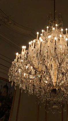 a chandelier hanging from the ceiling in a room