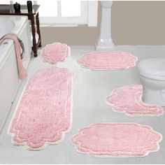 pink bathroom rugs and bath mats on the floor