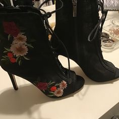 Gorgeous Black Embroidered Lace Up Booties. Size 6 1/2. New, Never Worn. Black Embroidered Open Toe Heels, Party High Heel Embroidered Boots, Spring High Heel Boots With Floral Embroidery, Black Embroidered Evening Heels, Spring Embroidered Fitted Heels, Embroidered Summer Party Boots, Embroidered Closed Toe Party Boots, Embroidered High Heel Boots For Spring, Open Toe Heels With Floral Embroidery For Evening