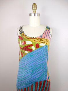 "This is such a rare dress from Missoni. It's fully embellished with clear sequins on silk with a funky abstract design. It's in excellent condition! Measurements: (note, there's a little stretch in the material) Bust - 32-36\" Waist - 30-34\" Hips - 36-40\" Total Length - 39\" This dress comes from a pet-free and smoke-free home. If you would like more info or have any questions, please don't hesitate to ask!" Embellished Multicolor Sequin Dress For Summer, Embellished Multicolor Sequin Summer Dress, Multicolor Embellished Sequin Summer Dress, Multicolor Embellished Sequin Dress For Summer, Fitted Multicolor Sequin Fabric For Summer, Spring Embellished Multicolor Sequin Fabric, Fitted Summer Dress With Mirror Work, Summer Fitted Dress With Mirror Work, Hand Embellished Sleeveless Summer Dress