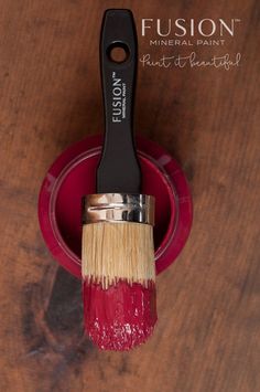 a paintbrush is sitting on top of a red bowl with the words, my painted door