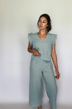 For the babes living in sun... Stay comfortable in style with these Double Gauze Smocking Waist Pants. The perfect pick for relaxed easy days. Crafted from lightweight cotton, with a smocking waist for a comfortable fit. Discover your favorite new look in these feminine and fashionable pants! Product Details: ❥ Color: Sea Blue ❥ Gauze pants for women ❥ Smocking high waist detail ❥ Side pockets ❥ Lightweight / breathable material❥ Make sure to check out the matching Gauze Ruffled Sleeve Top for Beach Cotton Bottoms With Smocked Bodice, Beach Bottoms With Smocked Bodice In Cotton, Chic Cotton Bottoms With Smocked Back, Casual Loungewear Bottoms With Smocked Back, Casual Pants With Smocked Back For Vacation, Casual Cotton Bottoms With Smocked Back, Casual Summer Bottoms With Smocked Cuffs, Gauze Pants, Easy Day