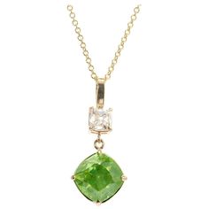 Cushion brilliant cut sphene and diamond pendant necklace. AGL certified center stone with an accent old mine diamond. 18k yellow gold. The stones are from an estate circa 1800’s. The pendant is from the Peter Suchy Workshop. 1 cushion cut green SI sphere, Approximate 4.97ct AGL Certificate # 109053 1 old mine cut I-I1 diamond, Approximate .88ct GIA Certificate # 1186650462 18k yellow gold Stamped: 750 18k 5.2 grams Top to bottom: 26.3mm or 1 Inches Width: 11.5mm or 7/16 Inches Depth or thickness: 8.29mm Chain: 18 Inches Total length: 19 Inches Pendant Necklace Diamond, Gia Certificate, Repurposed Jewelry, Necklace Diamond, Rare Gemstones, Diamond Gold, Yellow Gold Pendants, Diamond Pendant Necklace, Gold Pendant Necklace