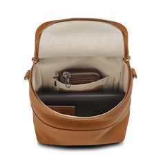 the inside of a brown leather purse with its zipper open and two compartments in it