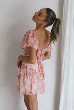 Pink floral print dress Partially lined Ruched bodice Puff sleeves Shirred from waist to hemline Tie-up back Zipper in back Your closet is calling, it needs this dress, now! We are obsessed with our Joie dress, with its romantic puff sleeves and tie-up back, it's giving us all the feels. Perfect for a birthday party or special occasion. Team it with nude, strappy heels and a feminine purse for a look we're in love with. MODEL INFO Model is wearing size XS Height: 5'7" Bust: 31" Waist: 25" Hips: Feminine Purse, Pink Selfie, Pink Floral Print Dress, Nude Strappy Heels, Selfie Leslie, Yellow Bridesmaids, Veil Hairstyles, Frill Dress, Pink Floral Print