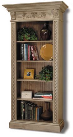 a wooden bookcase with books on top of it and other items in the bottom shelf