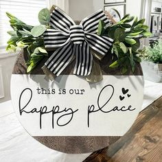 this is our happy place sign with bow