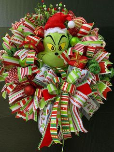 a christmas wreath with an elf's head on it