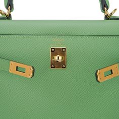 Guaranteed authentic Hermes Kelly Sellier 25 bag featured in fresh Vert Criquet. Stunning Hermes light green that is absolutely neutral. Luxurious with gold hardware.Epsom leather accentuates colours beautifully as it saturates to perfection. Comes with signature Hermes box, raincoat, shoulder strap, sleepers, lock, keys and clochette. NEW or NEVER WORN.The Hermes Kelly Sellier 25 cm bag price retains its value due to the rarity and high demand. As a purveyor of exceptional and unique Hermes lux Luxury Green Office Bags, Designer Green Bags With Branded Hardware, Classic Green Bag With Detachable Handle, Green Office Bag With Branded Hardware, Yellow Gold Rectangular Travel Bag, Luxury Green Bag With Detachable Strap, Luxury Green Shoulder Bag, Yellow Gold Bag With Gold-tone Hardware And Top Handle, Yellow Gold Bags With Gold-tone Hardware And Top Handle