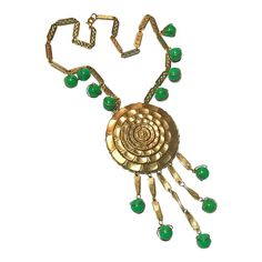 This is part of Chairish’s Costume Jewelry assortment.  Vintage Gold Green Statement Necklace 1970s Sunflower Dangles Beads  ------------------  Stylish gold necklace with beautiful green round beads...the middle pendant is a sunflower design...multiple green beads at the chain plus 5 dangles each ending with that same green bead encased in gold...secure closure.  Overall length of chain: 18"   Plus total pendant drop: 5.50" Vintage Green Dangle Necklaces, Vintage Green Beaded Chain Jewelry, Vintage Green Jewelry With Beaded Chain, Vintage Green Pendant Beaded Necklace, Green Costume Jewelry Necklace With Dangling Beads, Vintage Green Necklace With Beaded Chain, Green Sunflower, Green Statement Necklace, Green Beads