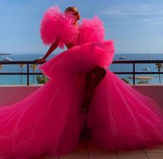 Step into elegance with this exquisite Hot Pink Tulle Ruffle Dress, designed to make a statement at any event. Whether you're attending a wedding, gala, or cocktail party, this dress offers a perfect blend of romance and sophistication. The soft, flowing layers of tulle create a flattering, ethereal silhouette, while the rich pink hue adds a touch of regal charm. Wedding Afterparty Dress, Hot Pink Tulle Dress, Afterparty Dress, Wedding Afterparty, Tulle Ruffle Dress, Maternity Photoshoot Dress, Pink Tulle Dress, Ruffle Gown, Wedding After Party