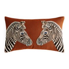 two zebras are shown on the back of this decorative throw pillow, which is hand - sewn and beaded