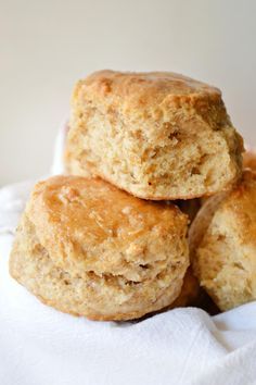 four apple biscuits stacked on top of each other in a white paper towel with text overlay