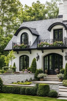 a white and black house with lots of windows