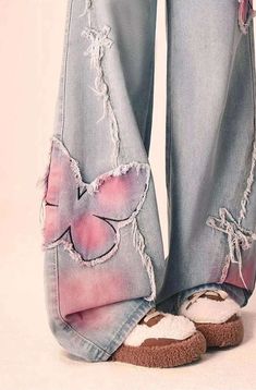 Rock these Distressed Pink Butterfly Jeans 🦋 and make a statement with their unique distressed design. These cute and pretty jeans feature edgy pink butterfly designs that will surely turn heads. Be bold and playful with your fashion choice! Size Chart: Size Waist (cm) Hip (cm) Length (cm) Waist (in) Hip (in) Length (in) S 63 94 100 24.80 37.01 39.37 M 67 98 101 26.38 38.58 39.76 L 71 102 102 27.95 40.16 40.16 XL 75 106 103 29.53 41.73 40.55 Description: Item Type: JeansJeans Style: High Waist Wide Leg PantsClosure Type: Zipper FlyMaterial: Cotton/LinenElasticity: Slight StretchLength: Full LengthFit Type: LooseDecoration: EmbroideryOrigin: CN Thickness: Regular Butterfly Cutout Jeans, Butterfly Core Outfits, Cool Jeans Design, Jeans With Patterns, Unique Clothing Pieces, Artsy Jeans, Jeans With Hearts, Pink And Blue Outfit, Butterfly Clothing