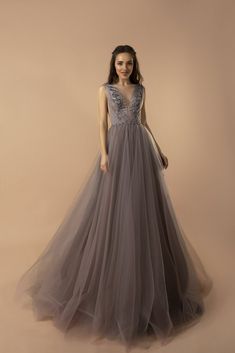 Elegant Embellished V-Neck Grey Tulle Gown with Cinched Waist and Flowing Skirt - A Line Wedding Dress Plus Size - WonderlandByLilian V-neck Dress With Sweep Train For Debutante Ball, V-neck Tulle Ball Gown For Formal Occasions, Embellished Tulle V-neck Gown, V-neck Sweep Train Dress For Debutante Ball, V-neck Tulle Gown With Fitted Bodice, V-neck Gown With Fitted Bodice And Tulle Material, Fitted Bodice Tulle Gown With V-neck, Evening V-neck Tulle Ball Gown, V-neck Tulle Ball Gown For Evening