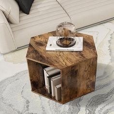 a small wooden table sitting on top of a rug