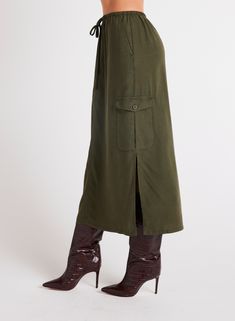 This Cargo Midi Skirt is a versatile addition to any wardrobe, featuring side slits for ease of movement and practical pockets for convenience. Made from soft Tencel fabric, this skirt is not only comfortable to wear but also stylish in beautiful colors. 100% TENCEL™Lyocell. Casual Full-length Skirt For Workwear, Versatile Full Length Lined Skirt Bottoms, Knee-length Utility Cargo Skirt With Pockets, Fall Cargo Skirt With Pockets For Workwear, Utility Mini Skirt With Side Pockets, Utility Style Long Skirt With Cargo Pockets, Green Workwear Skirt With Pockets, Utility Skirt With Pockets For Work, Workwear Skirt With Patch Pockets And Relaxed Fit