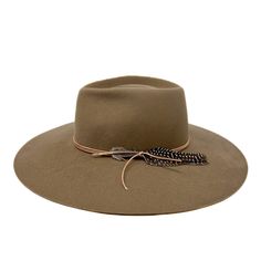 Remaining true to our classic shapes but with a twist! The montana fedora is made from a lite stockman felt and has a slightly rounder crown and has a stiff and sturdy feel . Trimmed with deer skin leather and feather, she will be your new fall fave! Add "custom embroidery" to make it more personal. Made in the U.S.A small 21-22 inches medium 22-23 inches large 23-24 inches Fall Faves, Felt Fedora, Deer Skin, Custom Embroidery, We Wear, Fedora, Montana, Deer, Felt