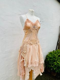 Fairy Wedding dress in a delicate peach look ,bridal gown romantic, wedding dress  upcycled antique lace, Vintage inspired one of a kind , Hippie and Boho bride to be.  Peach fabric covered with delicate antique laces and crochets . Skirt is ragged fabric  pieces in a fairy look . Length can be adjusted on request . There is lace up in the back , which Will adjust the dress according to your body figure .  Will fit sizes Xs, s, m ,L,  READY MADE Boho wedding dress, the dress you will receive is Woodland Wedding Dress, Fairy Look, Wedding Dresses Whimsical, Fairy Wedding Dress, Boho Beach Wedding, Fairy Wedding, Wedding Dresses Beaded, Beaded Wedding, Antique Lace