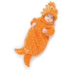 a baby in an orange animal costume laying on its back with his arms wrapped around the body