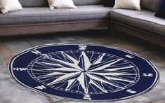 a blue and white rug with a compass on it