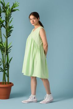 Sleeveless linen dress, Empire waist dress, Summer midi dress, Knee length Linen dress, V neck midi dress, Empire waist midi dress>DESCRIPTION<- loose and roomy- made from Linen blend. The fabric is of medium weight (185 g).- the model is 172 cm high (regular XS - S) and is wearing size S. - color in the picture - TEA GREEN - (Please choose colors from drop down menu).>FIT<- The dress is a bit loose and roomy.>COLOR<- The dress is available in 40 colors.- We found out the fabri Cotton V-neck Sundress For Daywear, Knee-length Midi Dress For Vacation, Casual Green Sleeveless V-neck Dress, Summer Linen V-neck Sundress, Summer A-line Midi Dress For Daywear, Green Sleeveless Knee-length Dress For Spring, Green Sleeveless Knee-length Spring Dress, Green Sleeveless Knee-length Summer Dress, Green Knee-length Sleeveless Summer Dress