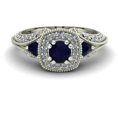 an oval shaped blue sapphire and diamond ring with two rows of diamonds around the band