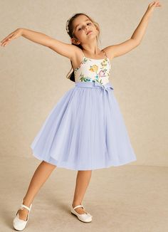 Jollie features a delightful A-line silhouette crafted from matte satin and tulle. Its square neckline and delicate spaghetti straps are accentuated by charming bows, combining playful elegance for a picture-perfect look. Lavender Flower Girl Dress, Lilac Flower Girl Dresses, Flower Girl Dresses Blue, Tulle Flower Girl, Flower Girl Dresses Tulle, Lilac Flowers, Matte Satin, Silhouette Crafts, A Princess