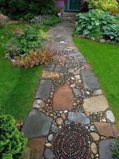 a stone path in front of a house