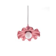 a pink flower shaped light hanging from a wire