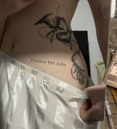 a person with a tattoo on their stomach