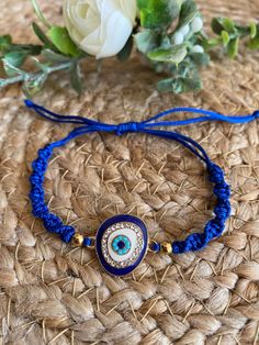 Evil eye adjustable bracelet ∙ ∙ ∙ ∙ ∙ ∙ ∙ ∙ ∙ ∙ ∙ ∙ ∙ ∙ ∙ ∙ ∙ ∙ ∙ ∙ ∙ ∙ ∙ ∙ ∙ ∙ ∙ ∙ ∙ ∙ ∙ ∙ ∙ ∙  ∙ EVIL EYE OR NAZAR ∙ Is an eyed-shaped bead used as an amulet to protect against the evil eye and bad energies. It comes from Turkey and Greece. According to tradition, which goes back to the times of ancient Egypt and Babylon, the ill feelings of the human being are projected through the eyes, because these are the most expressive part of the body. It is so by taking this amulet will absorb the bad energies that one receives.⠀ ∙ BRACELET MATERIALS ∙ - One zinc alloy evil eye charm 🧿  - Two stainless steel 4mm bead - Blue nylon cord 🧵  ∙ BRACELET SIZE ∙ Long adjustable up to 23 cm (9 inches).  If a larger size is needed, please leave me a message. ∙ SHIPPING ∙ - Domestic (U.S.): 3 - 5 busin Threaded Bracelet, Bracelet Materials, Bracelet Evil Eye, Evil Eye Protection, Thread Bracelets, Bracelet Blue, Blue Evil Eye, Eye Bracelet, Evil Eye Charm