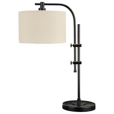 a lamp that is on top of a stand with a white shade over it and a black base