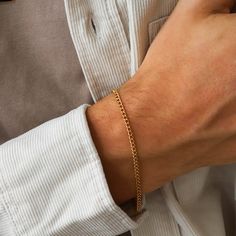 "Gold chain bracelet for men - this bracelet features a curb chain made in gold filled materials and is the best men's jewelry for everyday wear. Great gift for yourself, a boyfriend, a husband, a father and really anyone! Purchase with the Curb Chain Necklace for Men: https://www.etsy.com/listing/1121898259 D E T A I L S * Gold filled chain bracelet * Lobstar clasp * Nickel-free L E N G T H * 7\" (17.7 cm) * 7.5\" (19.0 cm) * 8\" (20.3 cm) SHOP POLICIES Please refer to our shop policy section f Timeless Bracelet, Gold Arm Band, Gold Bracelet Simple, Mens Chain Bracelet, Gold Chain Bracelet, Gold Coin Necklace, Coin Bracelet, Mens Gold Bracelets, Gold Chains For Men