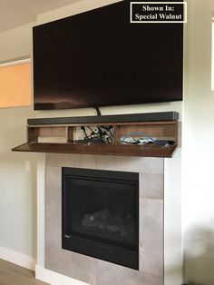 a flat screen tv mounted above a fireplace