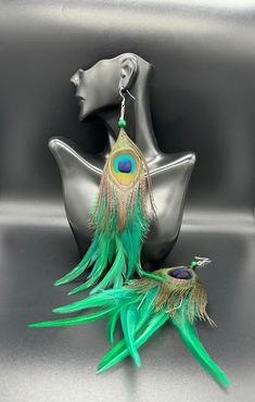 Tribal style green feathers and peacock feather dangle earring . Sold as pair Luxury Peacock Design Earrings For Festivals, Luxury Peacock Design Jewelry For Festivals, Green Feathered Earrings, Festive Dangle Jewelry, Music Festival Accessories, Green Feathers, Parrot Feather, Feather Diy, Peacock Feather Earrings