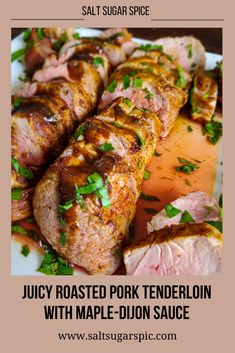 juicy roasted pork tenderloin with maple - dijon sauce on a white plate