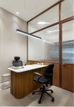 an office with a desk and chair in it