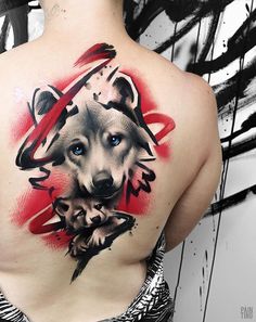 a man with a wolf tattoo on his back