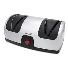 a white and black toaster sitting on top of a counter