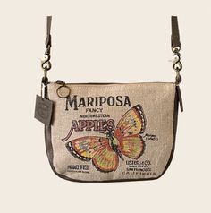 Mariposa Apple Crate Crossbody       American Glory are meticulously handcrafted Handbags & Accessories, inspired by history... vintage posters, advertisements and burlap sack designs are nostalgic and gives a connection to America's past. This petite but roomy pouch can fit all your essentials, cell phone fits in front insert pocket, wallet in the main body and keys/essentials in zippered pocket, not to mention there is a back outside zippered pocket.  Crossbody straps are removable so you can Vintage Upcycled Everyday Shoulder Bag, Vintage Upcycled Shoulder Bag For Everyday Use, Vintage Beige Bags Perfect For Gifts, Vintage Beige Bags For Gifts, Vintage Beige Bag For Gift, Vintage Upcycled Travel Shoulder Bag, Vintage Upcycled Shoulder Bag For Travel, Retro Bags With Zipper Pouch For Gifts, Retro Bags With Zipper Pouch As Gift