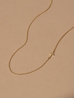 This small, studded cross pendant affixed to a simple gold chain is the finishing touch to any look. Crafted with 18k gold over sterling silver and real, slightly included round-cut diamonds, this is a dainty necklace you’ll want in your collection forever. Pair our Side Cross Vermeil Necklace with our Cross Vermeil Huggies for a full Vermeil look. | Gold Vermeil Side Cross Chain Necklace | Women's Jewelry by Uncommon James Minimalist Yellow Gold Cross Necklace With Clavicle Chain, Minimalist Yellow Gold Cross Necklace, Minimalist 14k Gold Cross Necklace With Delicate Chain, Everyday 14k Yellow Gold Cross Necklace, Yellow Gold Cross Necklace With Delicate Chain, Dainty Yellow Gold Cross Necklace For Everyday, Dainty Yellow Gold Cross Necklace With Adjustable Chain, Gold Jewelry With Cable Chain Cross Pendant, Gold Cross Pendant Cable Chain Jewelry