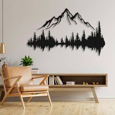 a living room with a wooden table and chair in front of a wall mounted mountain scene