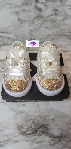 CONVERSE RUN BIG CHECK YOUR SIZE WITH LINK BELOW https://www.converse.com/size-chart-guide?id=infantandtoddler Infant and kids bling converse. For any occasion Bling Sneakers, Painting Shoes, Bling Converse, Converse Run, Bling Shirts, Wedding Sneakers, Custom Bling, Toddler Girl Shoes, Bling Shoes